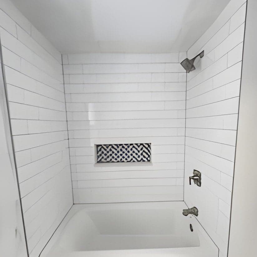 Completed modern bathroom with white subway tile shower