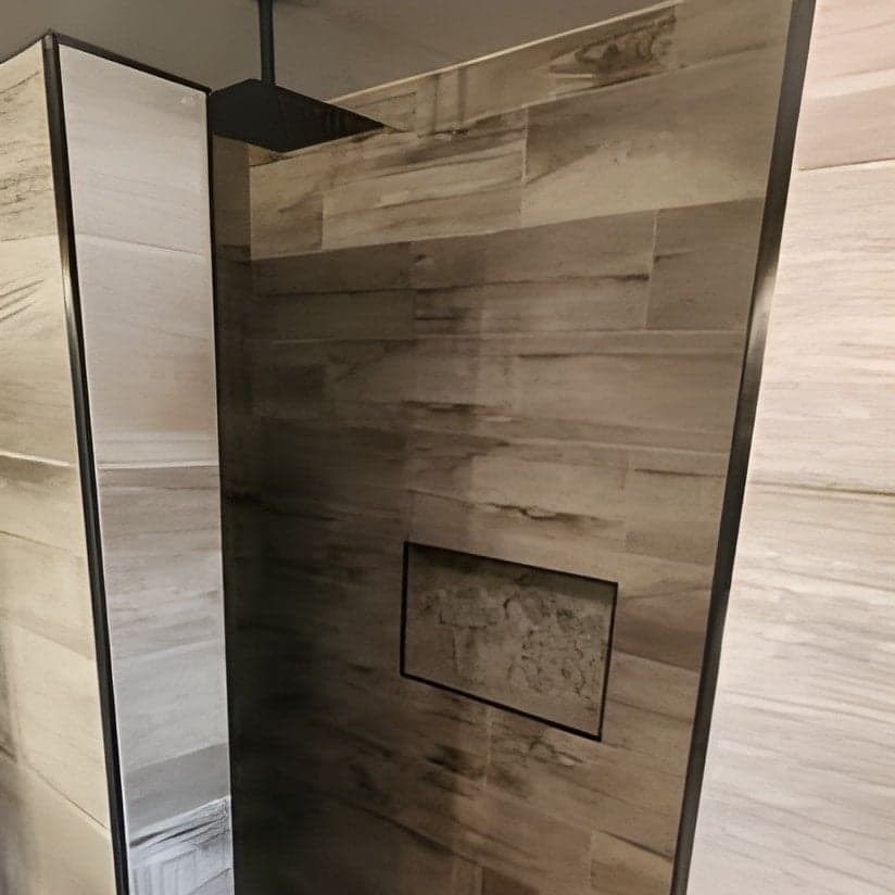 Finished walk-in shower with wood-look tile surround