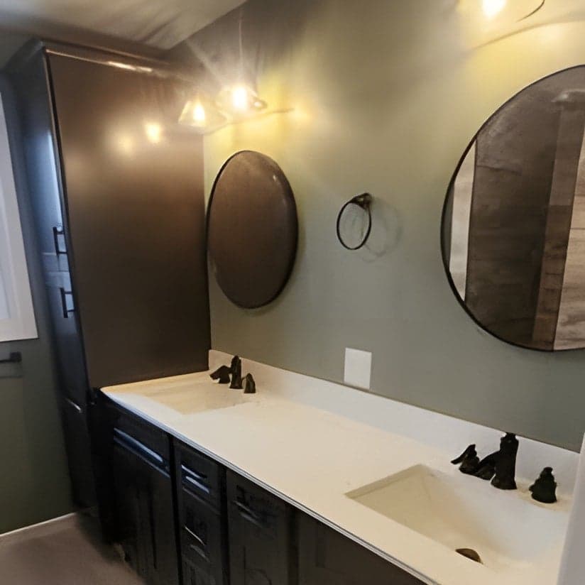 Finished bathroom vanity with dual sinks and mirrors
