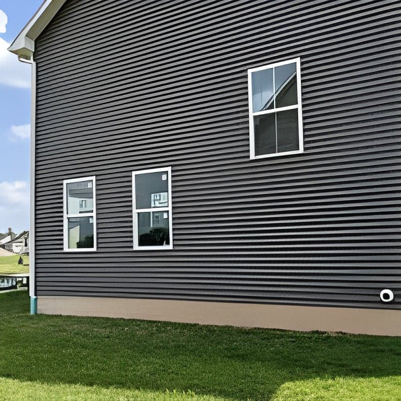 New vinyl siding installation on residential home exterior