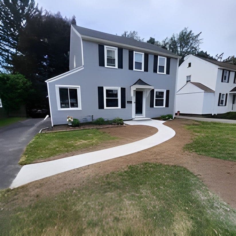 Colonial home with new curved driveway and landscaping
