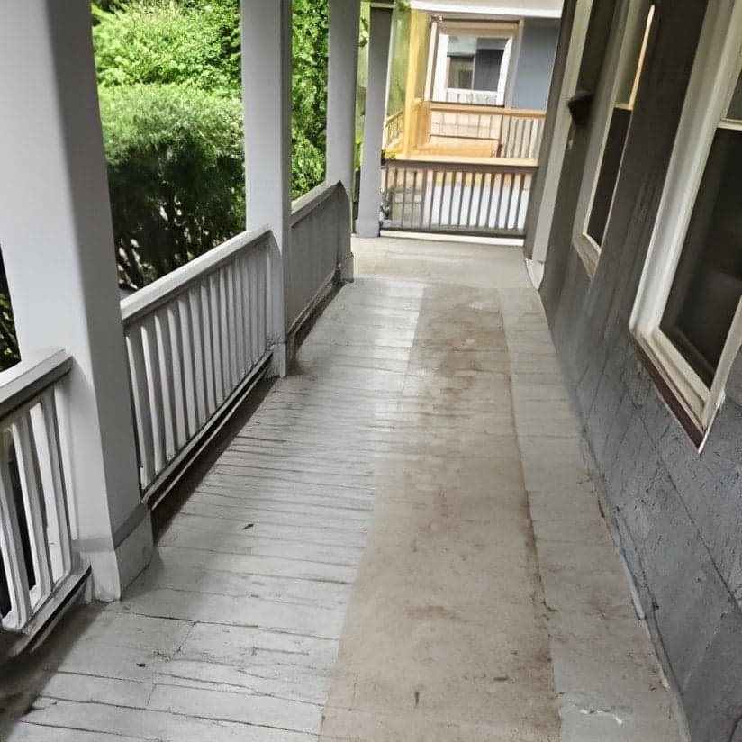 Finished porch with pavers and white railings