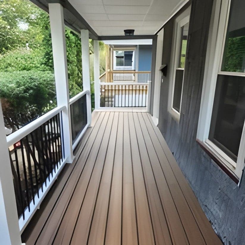Finished covered porch with composite decking and railings