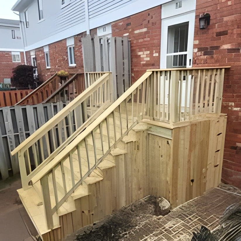 Newly constructed wooden deck with stairs and railings