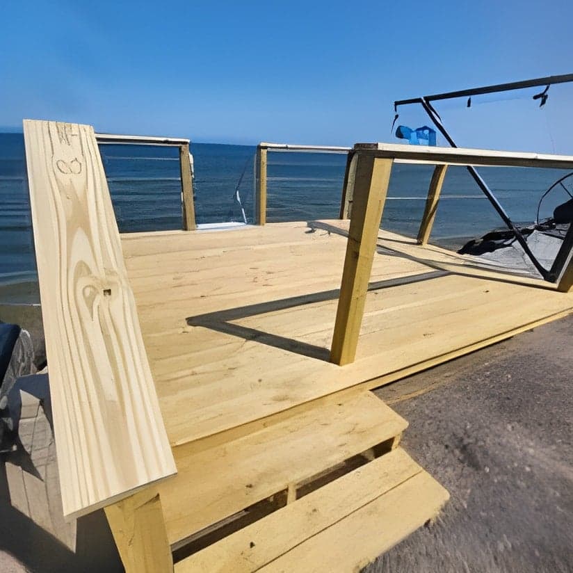 Wooden deck framing under construction near water