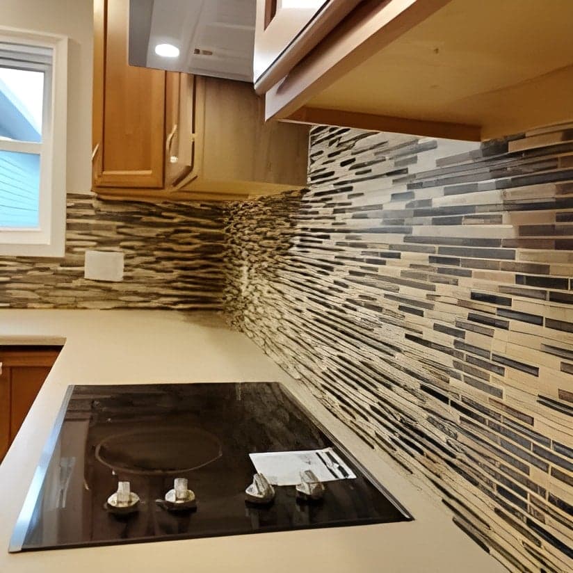 Modern kitchen with mosaic backsplash and cooktop