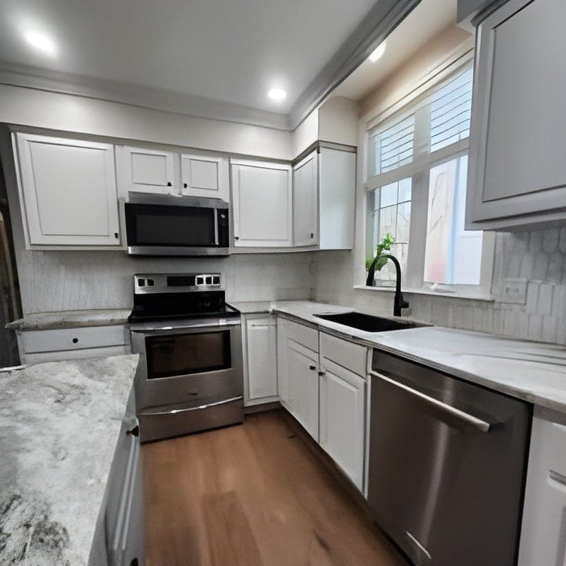 Modern kitchen with white cabinets and granite countertops